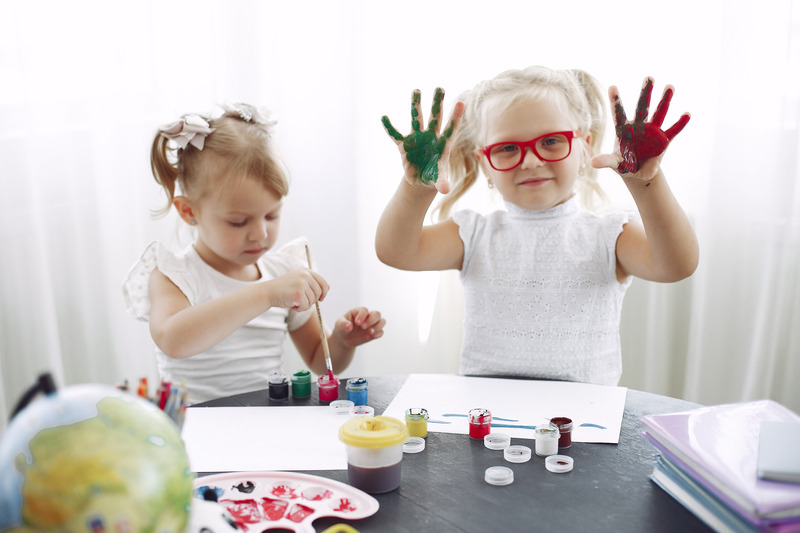 Canva - Children playing with paint in kindergarten